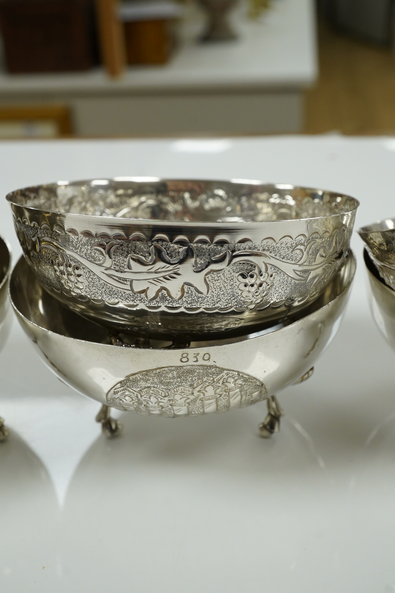 A set of nine Greek white metal footed bowls, stamped silver 830, 21.5 oz. Condition - good